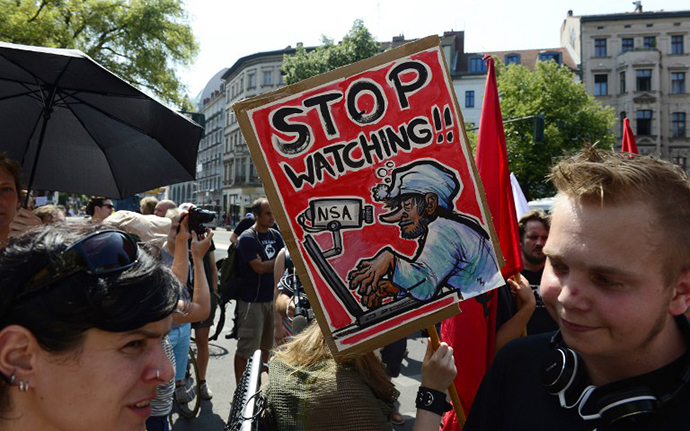 Demonstrators take part in a protest against the US National Security Agency (NSA) collecting German emails, online chats and phone calls and sharing some of it with the country's intelligence services in Berlin on July 27, 2013 (AFP Photo / John Macdougall)