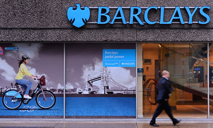 A man walks past a branch of Barclays bank in central London (AFP Photo / Carl Court)