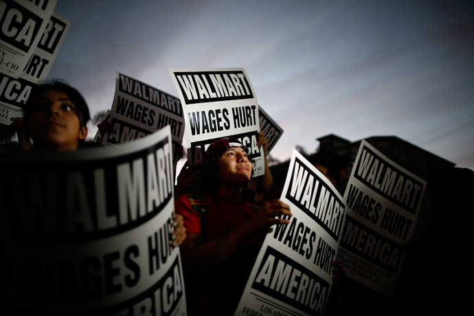 Pedro Taverna, 18, takes part in a protest for better wages outside Wal-mart in Los Angeles November 7, 2013. (Reuters / Lucy Nicholson)