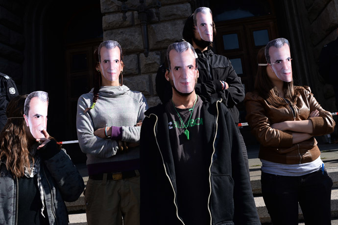 Students wear masks with a picture of Bulgarian Prime Minister Plamen Oresharski during an anti-government protest in Sofia on November 10, 2013. (AFP Photo/Dmitar Dilkoff)