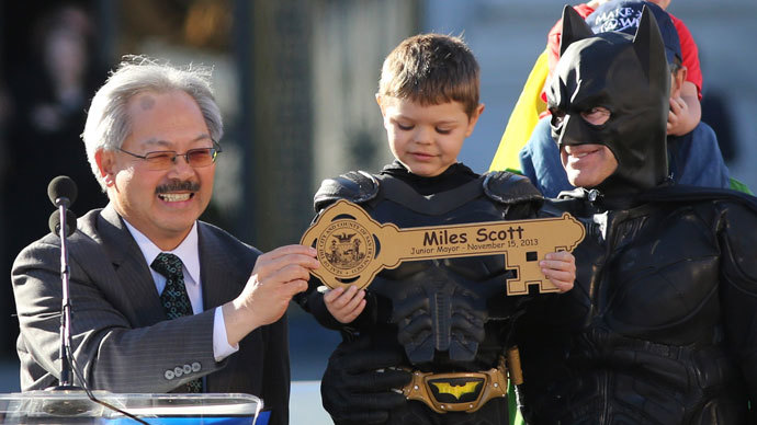 Five-year-old leukemia survivor Miles Scott, dressed as "Batkid" receive a key to the city declaring him "Junior Mayor" from San Francisco Mayor Ed Lee (L) during a ceremony as part of a day arranged by the Make- A - Wish Foundation in San Francisco, California November 15, 2013.(Reuters / Robert Galbraith)