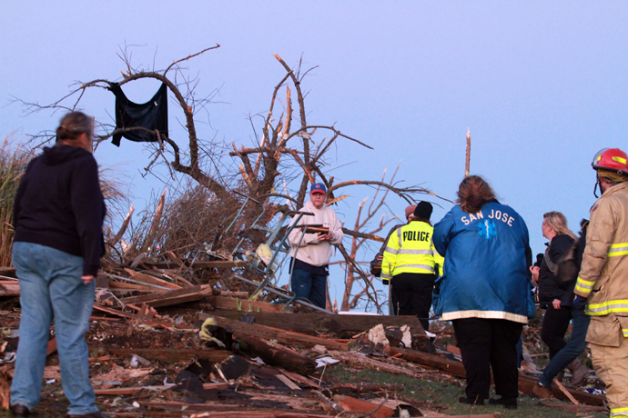 Residents of Elgin Avenue sort through debris after a tornado struck on November 17, 2013 in Washington, Illinois. (Tasos Katopodis / Getty Images / AFP) 