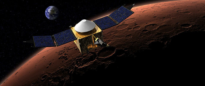 This artist's concept shows the MAVEN spacecraft in orbit around the Red Planet, with a fanciful image of her home planet in the background. (Credit: NASA/Goddard) 