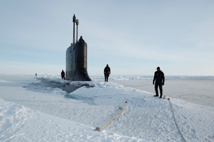 U.S. Navy safety swimmers stand on the deck of the Virginia class submarine USS New Hampshire after it surfaced through thin ice during exercises underneath ice in the Arctic Ocean north of Prudhoe Bay, Alaska (Reuters / Lucas Jackson)
