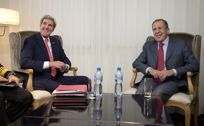 U.S. Secretary of State John Kerry (L) and Russia's Foreign Minister Sergei Lavrov smile during a photo opportunity prior to a meeting, in Geneva November 23, 2013. (Reuters/Carolyn Kaster)