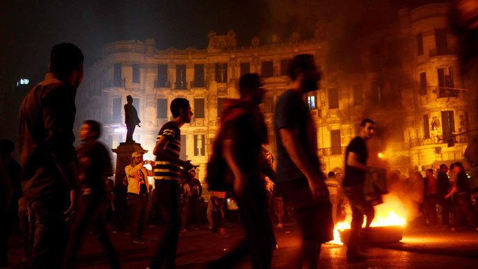 Egyptian protesters set fire to wood at Talaat Harb Square in downtown Cairo on November 26, 2013.(AFP Photo / Mohamed Abdelwahab)