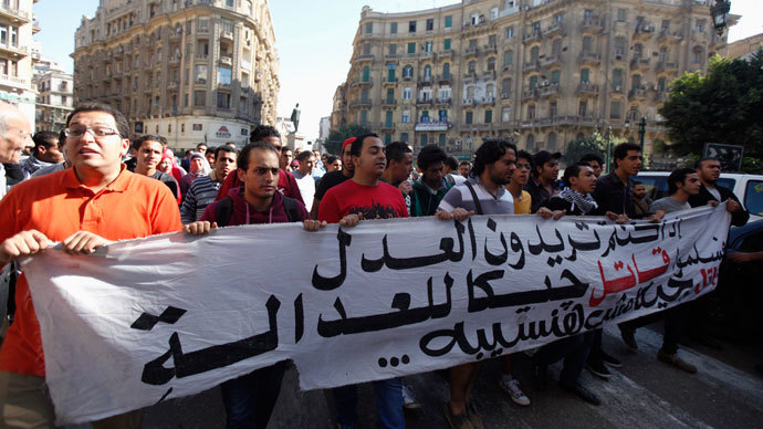 Anti-government protesters shout slogans against the military and interior ministry during a protest against a new law in Egypt that restricts demonstrations, in downtown Cairo November 26, 2013. (Reuters / Mohamed Abd El Ghany)