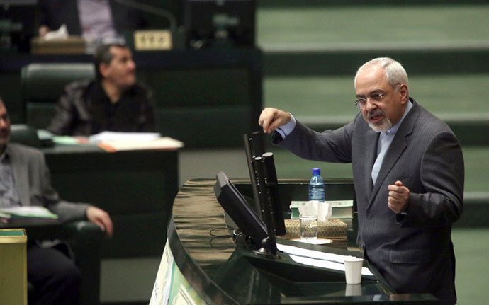 Iranian Foreign Minister Mohammad Javad Zarif addresses the parliament in Tehran on November 27, 2013, as MPs were reviewing the accord struck with world powers on the weekend over Iran's controversial nuclear programme. (AFP Photo / Atta Kenare)