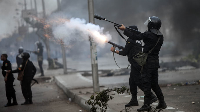 Egyptian Riot policemen fire tear gas towards protesters during a demonstration of Muslim Brotherhood and ousted President Mohamed Morsi on November 29, 2013 in Cairo, Egypt. (AFP Photo / Mahmoud Khaled)