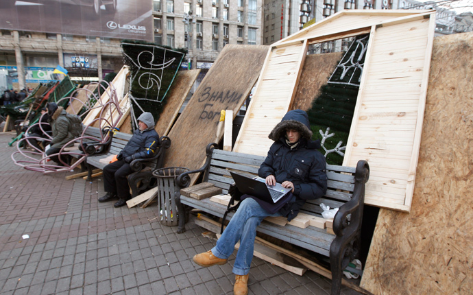 Protesters sit on barricades which blocked the main avenue in Kiev December 2, 2013. (Reuters / Vasily Fedosenko)