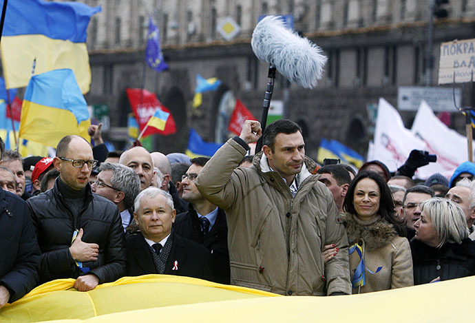 Vitaly Klitschko (3rd R, first row), heavyweight boxing champion and UDAR (Punch) party leader, Arseny Yatsenyuk (L, first row), a Ukrainian opposition leader, and Jaroslaw Kaczynski (2nd L, first row), leader of Poland's main opposition Law and Justice Party (PiS), attend a rally held by supporters of EU integration in Kiev, December 1, 2013. (Reuters / Vasily Fedosenko)