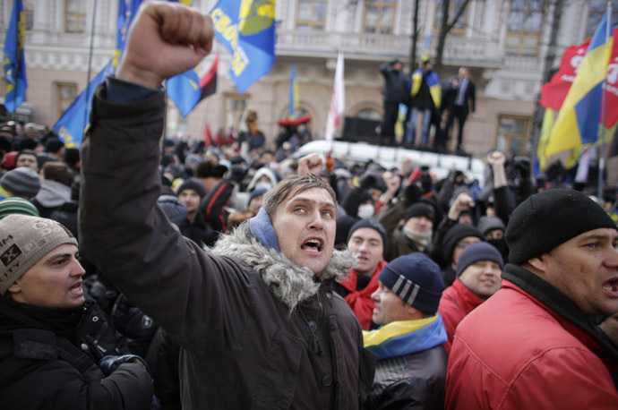Protestors wave flags and shout slogans outside parliament in Kiev December 3, 2013. (Reuters/Stoyan Nenov)