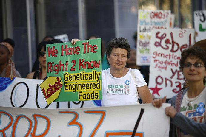 A demonstrator holds a sign during a rally in support of the state's upcoming Proposition 37 ballot measure in San Francisco (Reuters / Stephen Lam)