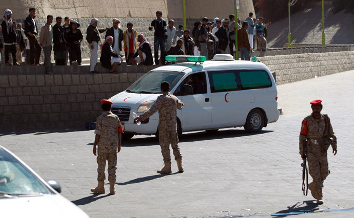 Emergency personnel arrive at the site of a suicide car bombing at the defence ministry in the Yemeni capital Sanaa on December 5, 2013.(AFP Photo / Mohammed Huwais)