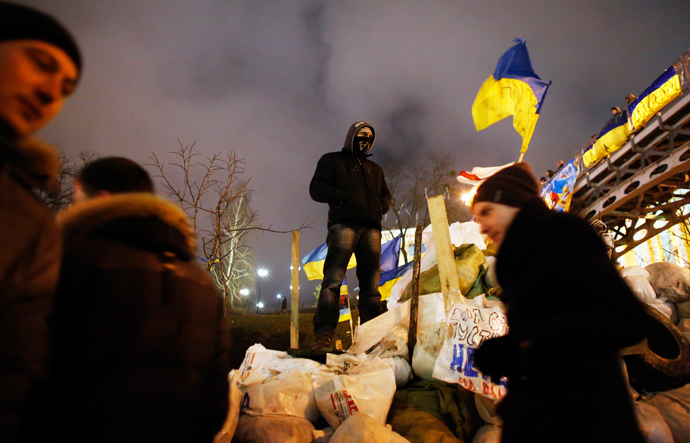 A pro-European integration protester stands on a barricade during a rally at Independence Square in Kiev December 17, 2013 (Reuters / Marko Djurica)