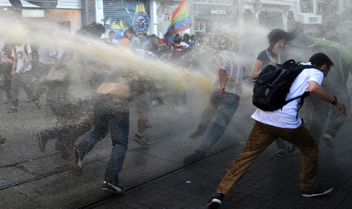 Turkish police disperse anti-government protestors with water cannons during a protest at the entrance of Taksim Square on July 20, 2013, in Istanbul. (AFP Photo/Bulent Kilic)