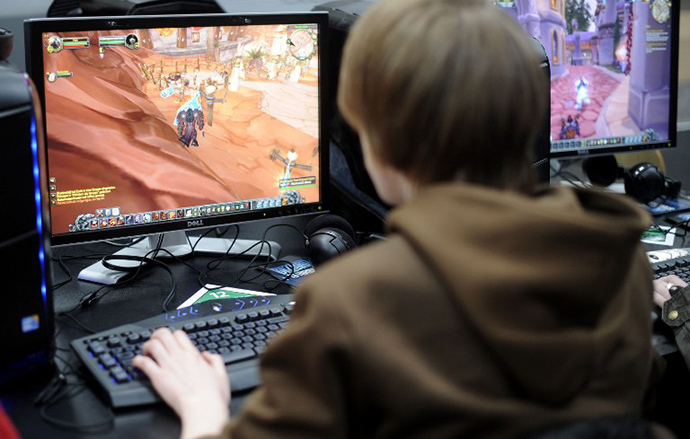 A visitor plays the computer game "World of Warcraft" at the world's biggest high-tech fair, the CeBIT (AFP Photo / Nigel Treblin)