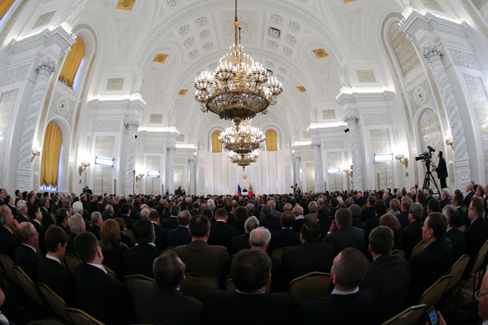 The audience listen to Russia's President Vladimir Putin as he gives his annual state of the nation address at the Kremlin in Moscow, December 12, 2013. (Reuters / Sergei Karpukhin)