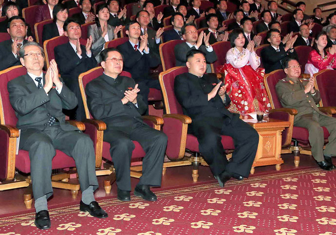 North Korean laeder Kim Jong-Un (C-front) and his uncle, Jang Song-Thaek (front 2nd L).(AFP Photo / KCNA)