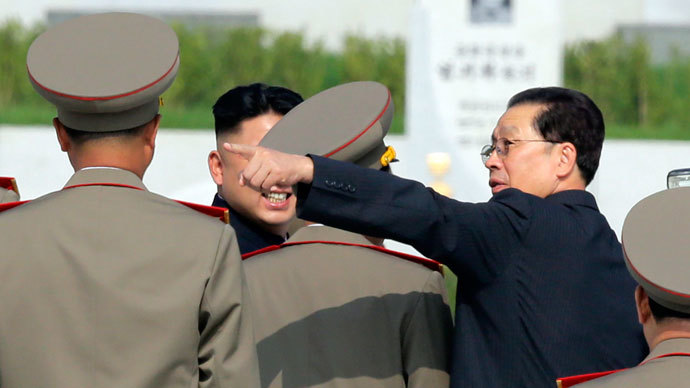North Korean politician Jang Song-thaek (R) gestures next to North Korean leader Kim Jong-un (L) as they attend a commemoration event at the Cemetery of Fallen Fighters of the Korean People's Army (KPA) in Pyongyang.(Reuters / Jason Lee)