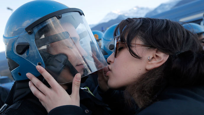 Italian girl ‘sexually assaulted’ riot cop with a kiss