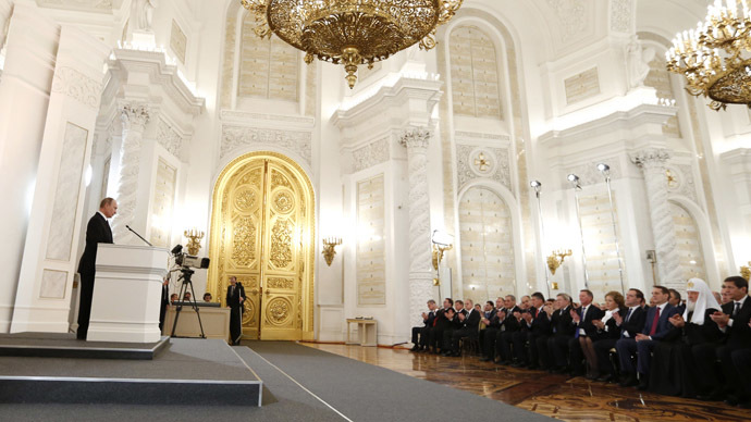 Russian President Vladimir Putin reads his annual address to the Federal Assembly in the St. George's Hall of the Kremlin. (RIA Novosti/Dmitry Astakhov)