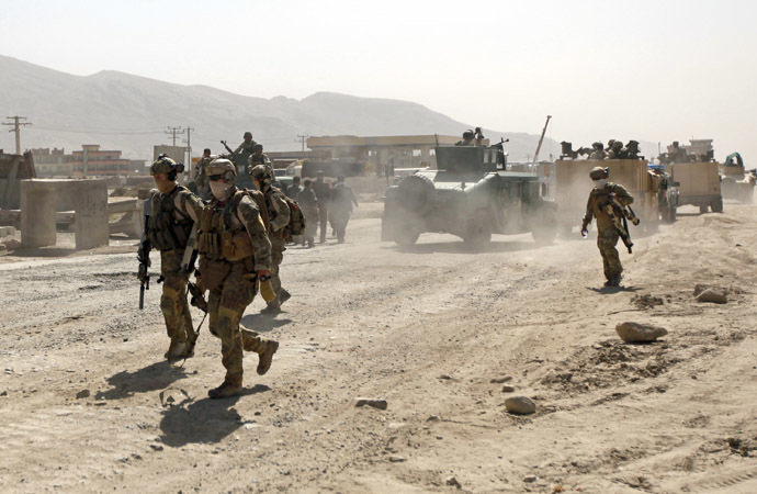 Members of the NATO-led International Security Assistance Force (ISAF) arrive at the site of an attack in Kabul June 10, 2013 (Reuters/Mohammad Ismail)
