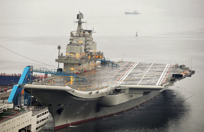 China's first aircraft carrier, which was renovated from an old aircraft carrier that China bought from Ukraine in 1998, is seen docked at Dalian Port, in Dalian, Liaoning province.(Reuters / Stringer)