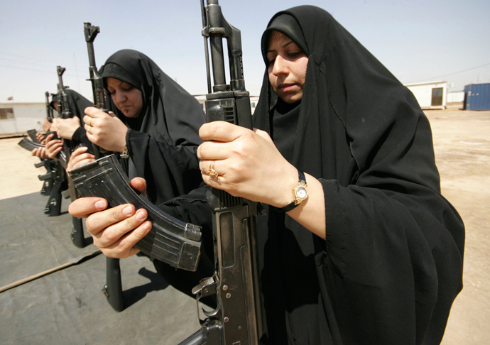 Policewomen practise assembling and disassembling a Kalashnikov automatic rifle during a training course at a police academy in Kerbala, 80 km (50 miles) southwest of Baghdad April 27, 2011. (Reuters / Mushtaq Muhammed)