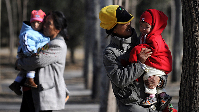 China eases notorious one-child policy, abolishes labor camps