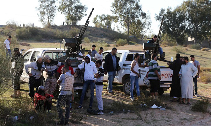 Members of the Tripoli Rebels Brigade militia patrol a main road in Tajura, 15 kms from the capital Tripoli (AFP Photo / Mahmud Turkia)