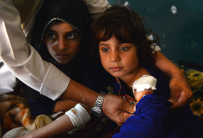 A Pakistani victim of US drone attack rests on a bed after she arrived with her brothers and sisters from the North Waziristan area of Ghundai Village for treatment in Peshawar on November 3, 2012, after US missile hit near their house on October 24. (AFP Photo / A Majeed)