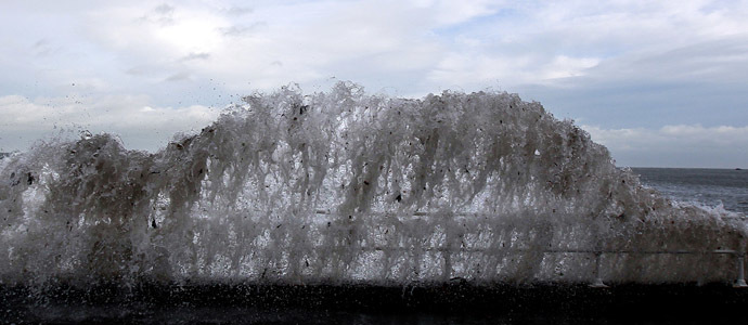 Waves crash against the coastal wall in the village of Carnlough as high tides and strong winds cause some flooding in coastal areas of Northern Ireland January 3, 2014. (Reuters/Cathal McNaughton)