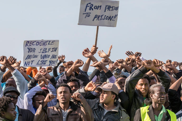 African asylum seekers who entered Israel illegally via Egypt stage a protest in front of several western embassies in the Mediterranean coastal city of Tel Aviv on January 6, 2014.(AFP Photo / Jack Guez)