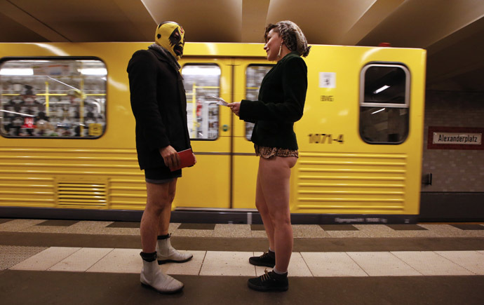 Passengers without their pants talk next to a subway train during the "No Pants Subway Ride" event at Alexanderplatz subway station in Berlin January 12, 2014. (Reuters/Fabrizio Bensch)