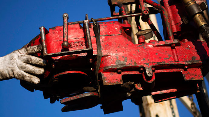 A man works on the rig of an oil drilling pump site in McKenzie County outside of Williston, North Dakota.(Reuters / Shannon Stapleton)