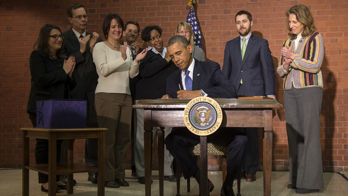 Safe from shutdown: Obama signs trillion-dollar budget