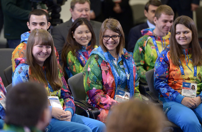 Volunteers taking part in preparing and holding the 22nd Winter Olympic Games and 11th Winter Paralympic Games in Sochi, at a meeting with President Vladimir Putin. (RIA Novosti/Aleksey Nikolskyi)