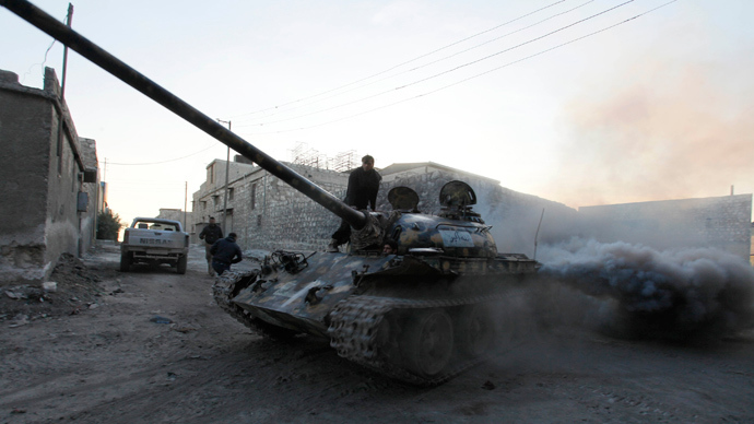 A Free Syrian Army tank drives through a street in Aleppo November 30, 2013 (Reuters / Molhem Barakat)