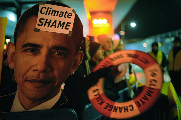 Activists demonstrate outside the Bella Center in Copenhagen early on December 19, 2009 at the end of the COP15 UN Climate Change Conference. (AFP Photo / Olivier Morin)