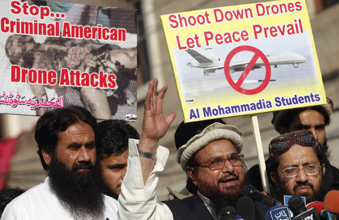 Hafiz Saeed, head of the Jamaat-ud-Dawa organisation and founder of Lashkar-e-Taiba, (2nd R) addresses supporters during a protest against U.S. drone attacks in the Pakistani tribal region, in Lahore November 29, 2013. (Reuters/Mohsin Raza)