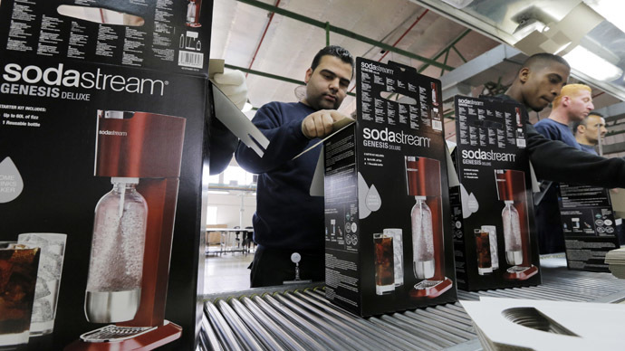 Employees pack boxes of the SodaStream product at the factory in the West Bank Jewish settlement of Maale Adumim January 28, 2014. (Reuters/Ammar Awad)