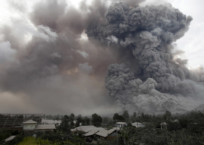An ash cloud from a Mount Sinabung eruption is seen from Kuta Tengah village in Karo district, Indonesia's North Sumatra province, January 14, 2014. (Reuters)
