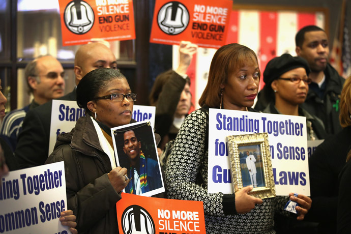 Gun violence victims and gun control advocates gather at Cornell Square Park to mark the anniversary of the Sandy Hook Elementary School shooting December 14, 2013 in Chicago, Illinois. (Scott Olson/Getty Images/AFP)