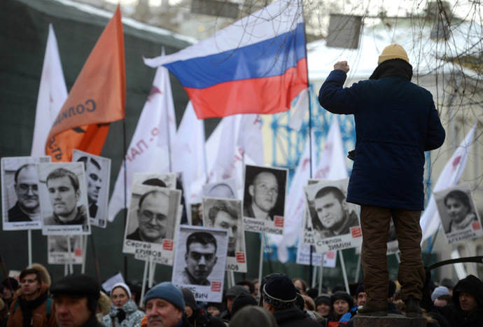 Participants attend the March for Freedom, staged in Moscow in support of the persons accused over the criminal case over mass disorders and application of force against representatives of authority during riots on Bolotnaya Square on May 6, 2012. (RIA Novosti/Kirill Kallinikov)