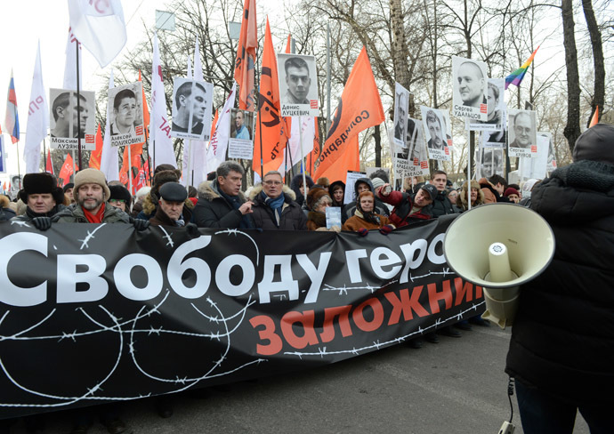 Participants attend the March for Freedom, staged in Moscow in support of the persons accused over the criminal case over mass disorders and application of force against representatives of authority during riots on Bolotnaya Square on May 6, 2012. (RIA Novosti/Kirill Kallinikov)