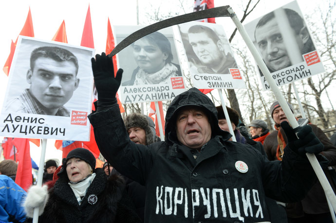 Participants attend the March for Freedom, staged in Moscow in support of the persons accused over the criminal case over mass disorders and application of force against representatives of authority during riots on Bolotnaya Square on May 6, 2012. (RIA Novosti/Kirill Kallinikov)