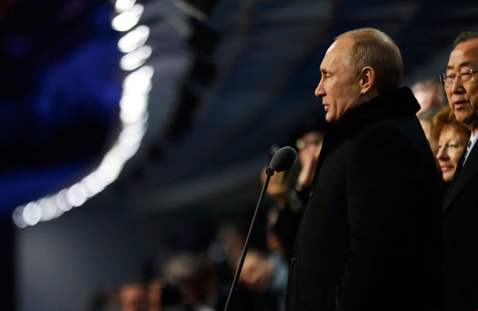 Russian President Vladimir Putin (R) stands to declare the 2014 Winter Olympics open during the opening ceremony on February 7, 2014, in Sochi, Russia.(AFP Photo / David Goldman)