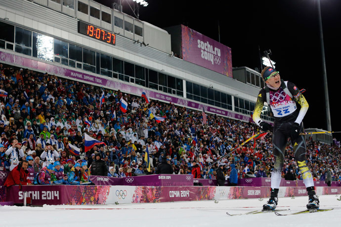 Slovakia's Anastasiya Kuzmina reacts as she crosses the finish line to win the women's biathlon 7.5km sprint event at the 2014 Sochi Winter Olympics February 9, 2014.(Reuters / Carlos Barria)