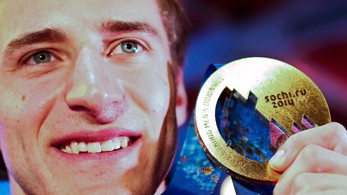 Gold medallist Matthias Mayer of Austria poses with his medal for the men's alpine skiing downhill race, at the Austrian hospitality house during the 2014 Sochi Winter Olympics in Rosa Khutor February 9, 2014. (Reuters / Dominic Ebenbichler)